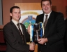 County Vice Chairman Jim Murray presents team captain Michael Hasson the Junior Hurling Championship trophy